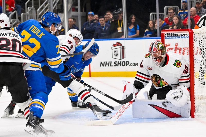 Dec 12, 2025; St. Louis, Missouri, USA; St. Louis Blues defenseman Justin Faulk (72) shoots and scores against Chicago Blackhawks goaltender Spencer Knight (30) during the second period at Enterprise Center. Mandatory Credit: Jeff Curry-Imagn Images