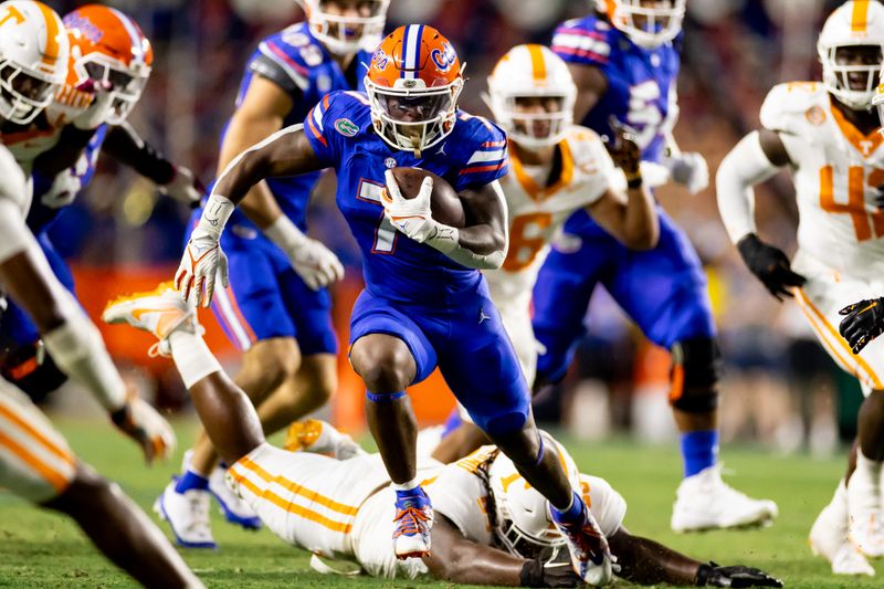 Sep 16, 2023; Gainesville, Florida, USA; Florida Gators running back Trevor Etienne (7) rushes with the ball during the first half against the Tennessee Volunteers at Ben Hill Griffin Stadium. Mandatory Credit: Matt Pendleton-USA TODAY Sports