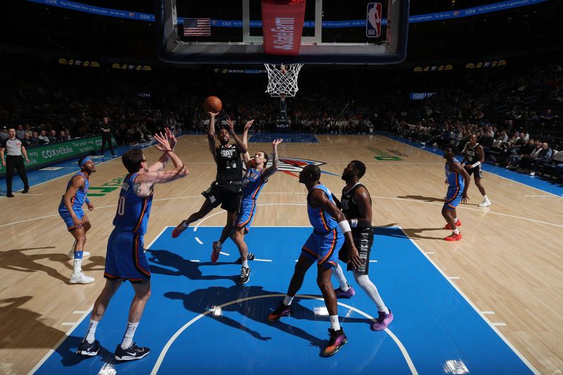 OKLAHOMA CITY, OK - APRIL 10:  Blake Wesley #14 of the San Antonio Spurs drives to the basket during the game against th eOklahoma City Thunder on April 10, 2024 at Paycom Arena in Oklahoma City, Oklahoma. NOTE TO USER: User expressly acknowledges and agrees that, by downloading and or using this photograph, User is consenting to the terms and conditions of the Getty Images License Agreement. Mandatory Copyright Notice: Copyright 2024 NBAE (Photo by Zach Beeker/NBAE via Getty Images)