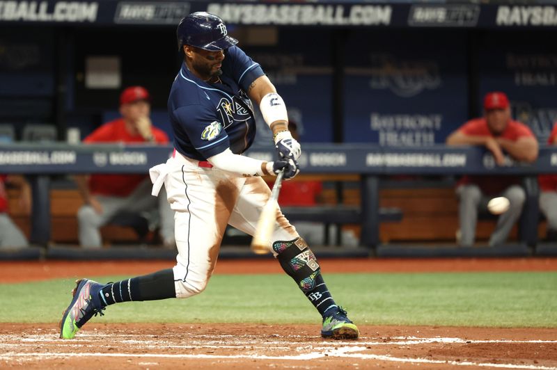 Sep 19, 2023; St. Petersburg, Florida, USA;  Tampa Bay Rays first baseman Yandy Diaz (2) singles against the Los Angeles Angels during the third inning at Tropicana Field. Mandatory Credit: Kim Klement Neitzel-USA TODAY Sports