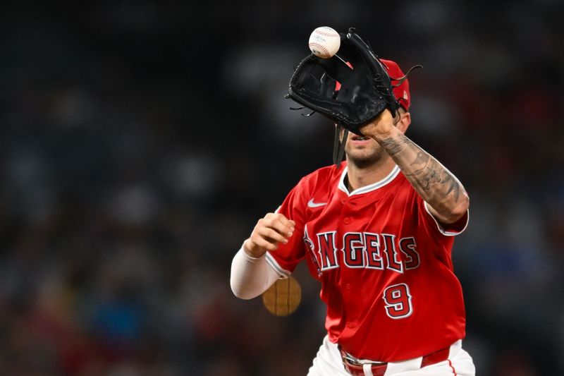 Aug 17, 2024; Anaheim, California, USA; Los Angeles Angels shortstop Zach Neto (9) makes a catch against the Atlanta Braves during the seventh inning at Angel Stadium. Mandatory Credit: Jonathan Hui-USA TODAY Sports