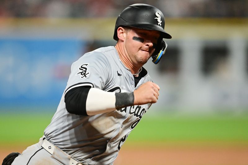 Apr 9, 2024; Cleveland, Ohio, USA; Chicago White Sox designated hitter Korey Lee (26) rounds third base en route to scoring during the eighth inning against the Cleveland Guardians at Progressive Field. Mandatory Credit: Ken Blaze-USA TODAY Sports