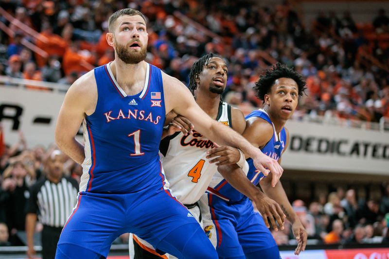 Jan 16, 2024; Stillwater, Oklahoma, USA; Kansas Jayhawks center Hunter Dickinson (1) blocks out Oklahoma State Cowboys guard Jarius Hicklen (4) during the first half at Gallagher-Iba Arena. Mandatory Credit: William Purnell-USA TODAY Sports