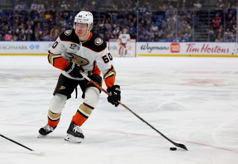 Feb 19, 2024; Buffalo, New York, USA;  Anaheim Ducks defenseman Jackson LaCombe (60) looks to make a pass during the third period against the Buffalo Sabres at KeyBank Center. Mandatory Credit: Timothy T. Ludwig-USA TODAY Sports