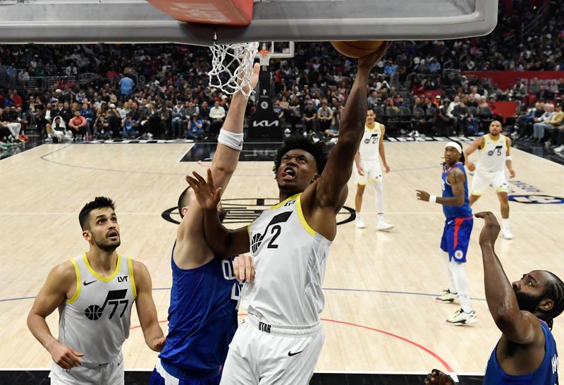 LOS ANGELES, CALIFORNIA - APRIL 5: Collin Sexton #2 of the Utah Jazz goes up for a layup against Ivica Zubac #40 of the Los Angeles Clippers during the first half at Crypto.com Arena on April 5, 2024 in Los Angeles, California. NOTE TO USER: User expressly acknowledges and agrees that, by downloading and or using this photograph, User is consenting to the terms and conditions of the Getty Images License Agreement. (Photo by Kevork Djansezian/Getty Images)