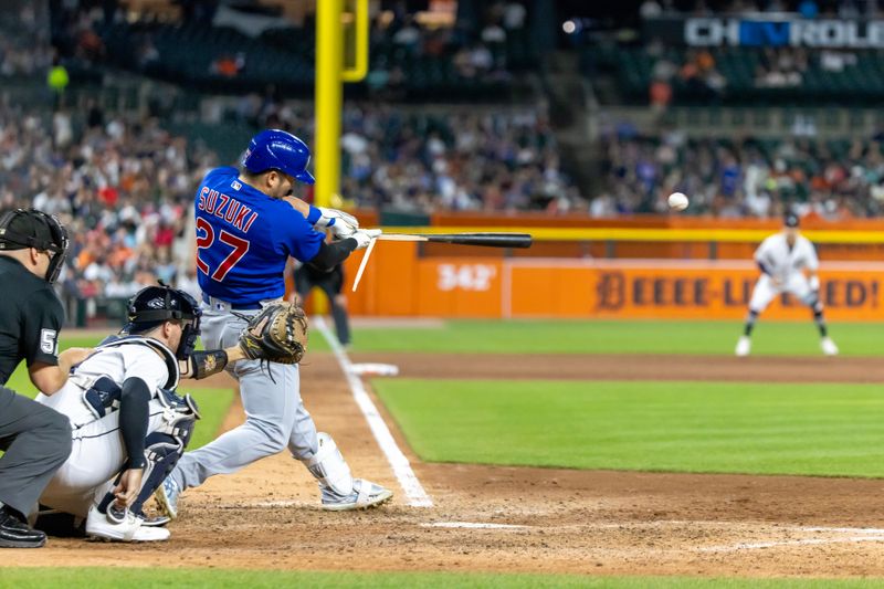 Aug 22, 2023; Detroit, Michigan, USA; Chicago Cubs right fielder Seiya Suzuki (27) hits a broken bat single in the eighth inning against the Detroit Tigers at Comerica Park. Mandatory Credit: David Reginek-USA TODAY Sports