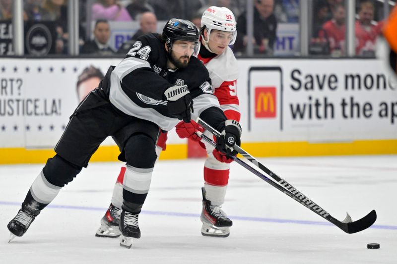Nov 16, 2024; Los Angeles, California, USA; Detroit Red Wings center Marco Kasper (92) and Los Angeles Kings left wing Tanner Jeannot (10) race for the puck in the second period at Crypto.com Arena. Mandatory Credit: Jayne Kamin-Oncea-Imagn Images