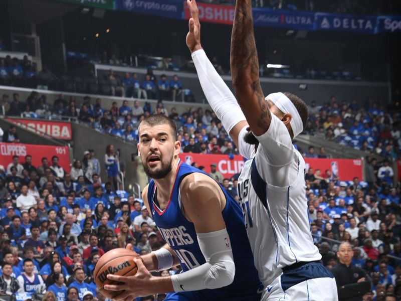 LOS ANGELES, CA - APRIL 21: Ivica Zubac #40 of the LA Clippers drives to the basket during the game against the Dallas Mavericks during the 2024 NBA Playoffs on April 21, 2024 at Crypto.Com Arena in Los Angeles, California. NOTE TO USER: User expressly acknowledges and agrees that, by downloading and/or using this Photograph, user is consenting to the terms and conditions of the Getty Images License Agreement. Mandatory Copyright Notice: Copyright 2024 NBAE (Photo by Andrew D. Bernstein/NBAE via Getty Images)