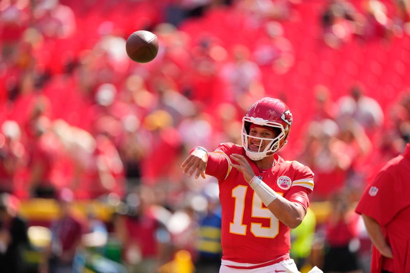 Kansas City Chiefs quarterback Patrick Mahomes warms up before the start of an NFL football game against the Cincinnati Bengals Sunday, Sept. 15, 2024, in Kansas City, Mo. (AP Photo/Charlie Riedel)