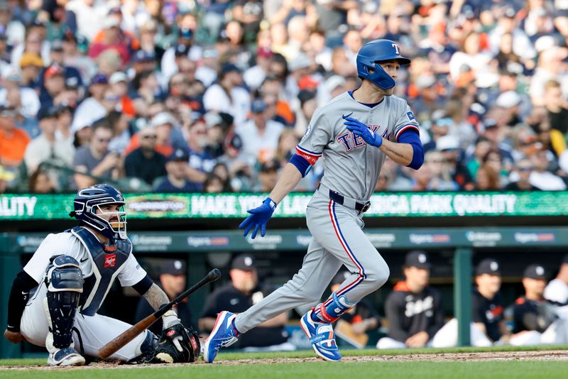 May 10, 2025; Detroit, Michigan, USA;  Texas Rangers outfielder Evan Carter (32) hits a home run in the second inning against the Detroit Tigers at Comerica Park. Mandatory Credit: Rick Osentoski-Imagn Images