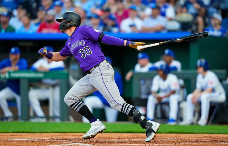 Apr 22, 2025; Kansas City, Missouri, USA; Colorado Rockies left fielder Aaron Schunk (30) hits a single during the third inning against the Kansas City Royals at Kauffman Stadium. Mandatory Credit: Jay Biggerstaff-Imagn Images