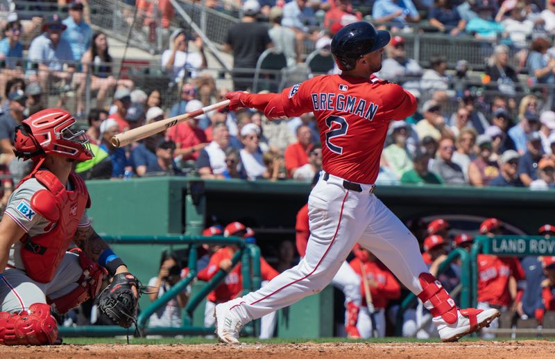 Mar 11, 2025; Fort Myers, Florida, USA;  Boston Red Sox Alex Bregman (2) connects with the ball in the first inning of their game with the Phillies  at JetBlue Park at Fenway South. Mandatory Credit: Chris Tilley-Imagn Images