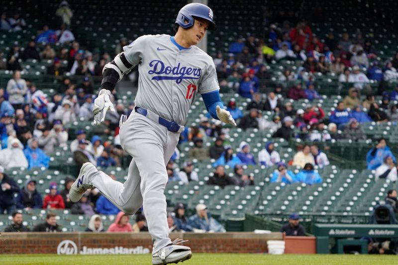 Apr 7, 2024; Chicago, Illinois, USA; Los Angeles Dodgers designated hitter Shohei Ohtani (17) hits a triple against the Chicago Cubs during the sixth inning at Wrigley Field. Mandatory Credit: David Banks-USA TODAY Sports