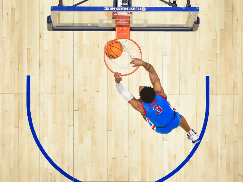 Mar 9, 2023; Nashville, TN, USA;  Mississippi Rebels forward Myles Burns (3) dunks against the Tennessee Volunteers during the second half at Bridgestone Arena. Mandatory Credit: Steve Roberts-USA TODAY Sports