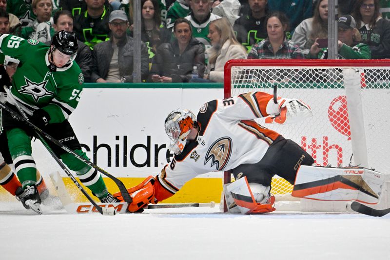 Jan 25, 2024; Dallas, Texas, USA; Anaheim Ducks goaltender John Gibson (36) knocks the puck away from Dallas Stars center Matt Duchene (95) during the third period at the American Airlines Center. Mandatory Credit: Jerome Miron-USA TODAY Sports