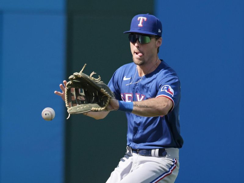 Sep 17, 2023; Cleveland, Ohio, USA; Texas Rangers left fielder Evan Carter (32) fields an RBI double hit by Cleveland Guardians second baseman Andres Gimenez (not pictured) during the fourth inning at Progressive Field. Mandatory Credit: Ken Blaze-USA TODAY Sports