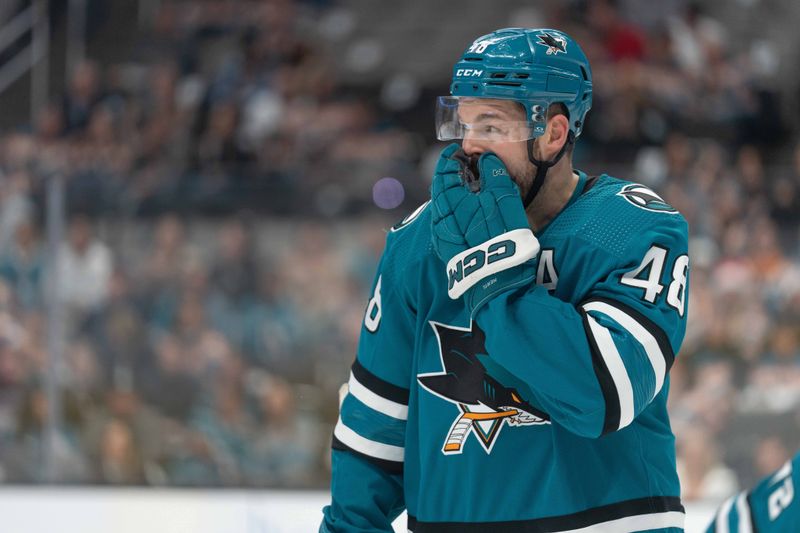 Dec 21, 2023; San Jose, California, USA; San Jose Sharks center Tomas Hertl (48) adjusts his mouthpiece during the second period against the Arizona Coyotes at SAP Center at San Jose. Mandatory Credit: Stan Szeto-USA TODAY Sports