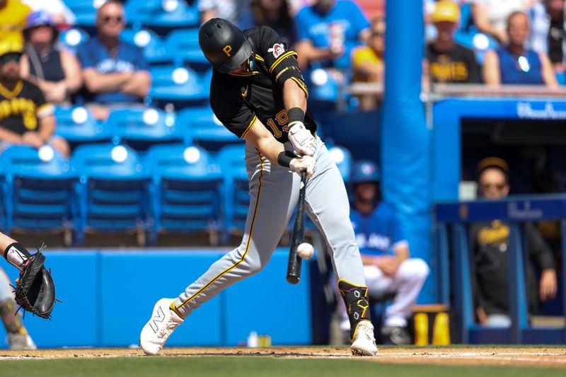 Feb 26, 2024; Dunedin, Florida, USA;  Pittsburgh Pirates second baseman Jared Triolo (19) hits a double against the Toronto Blue Jays in the first inning at TD Ballpark. Mandatory Credit: Nathan Ray Seebeck-USA TODAY Sports