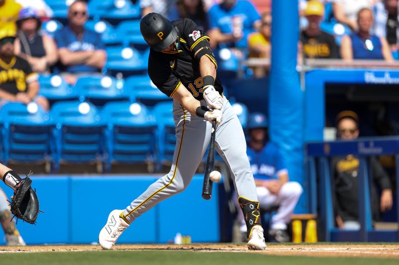 Feb 26, 2024; Dunedin, Florida, USA;  Pittsburgh Pirates second baseman Jared Triolo (19) hits a double against the Toronto Blue Jays in the first inning at TD Ballpark. Mandatory Credit: Nathan Ray Seebeck-USA TODAY Sports