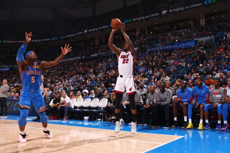 OKLAHOMA CITY, OK - MARCH 8:  Jimmy Butler #22 of the Miami Heat shoots a three point basket during the game against the Oklahoma City Thunder on March 8, 2024 at Paycom Arena in Oklahoma City, Oklahoma. NOTE TO USER: User expressly acknowledges and agrees that, by downloading and or using this photograph, User is consenting to the terms and conditions of the Getty Images License Agreement. Mandatory Copyright Notice: Copyright 2024 NBAE (Photo by Zach Beeker/NBAE via Getty Images)