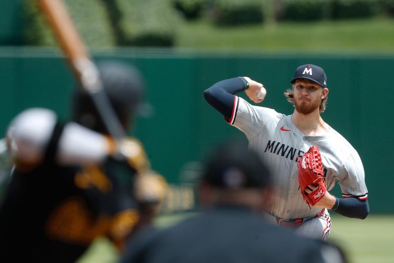 Jun 9, 2024; Pittsburgh, Pennsylvania, USA; Minnesota Twins starting pitcher Bailey Ober (17) delivers a pitches to  Pittsburgh Pirates right fielder Andrew McCutchen (22) during the first inning at PNC Park. Mandatory Credit: Charles LeClaire-USA TODAY Sports