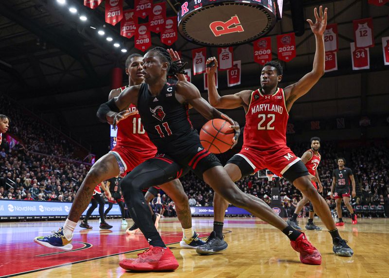 Feb 25, 2024; Piscataway, New Jersey, USA; Rutgers Scarlet Knights center Clifford Omoruyi (11) dribbles in front of Maryland Terrapins forward Julian Reese (10) and forward Jordan Geronimo (22) during the second half at Jersey Mike's Arena. Mandatory Credit: Vincent Carchietta-USA TODAY Sports