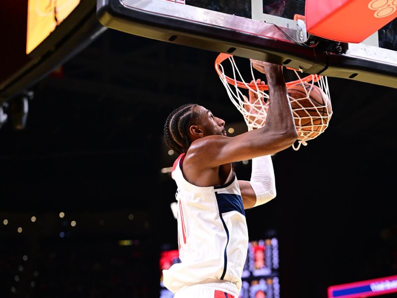 ATLANTA, GA - NOVEMBER 15:  Alexandre Sarr #20 of the Washington Wizards dunks the ball during the game against the Atlanta Hawks during the Emirates NBA Cup game on November 15, 2024 at State Farm Arena in Atlanta, Georgia.  NOTE TO USER: User expressly acknowledges and agrees that, by downloading and/or using this Photograph, user is consenting to the terms and conditions of the Getty Images License Agreement. Mandatory Copyright Notice: Copyright 2024 NBAE (Photo by Adam Hagy/NBAE via Getty Images)