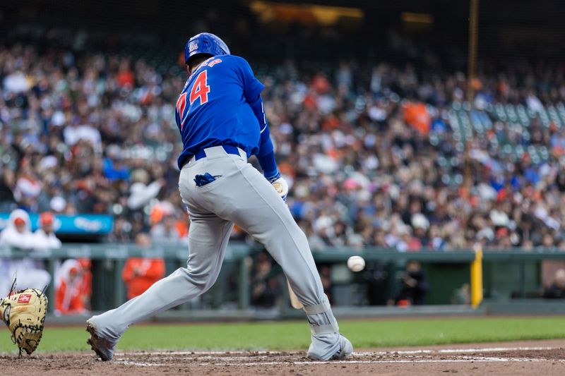 Jun 25, 2024; San Francisco, California, USA; Chicago Cubs right fielder Cody Bellinger (24) hits a single against the San Francisco Giants during the third inning at Oracle Park. Mandatory Credit: John Hefti-USA TODAY Sports