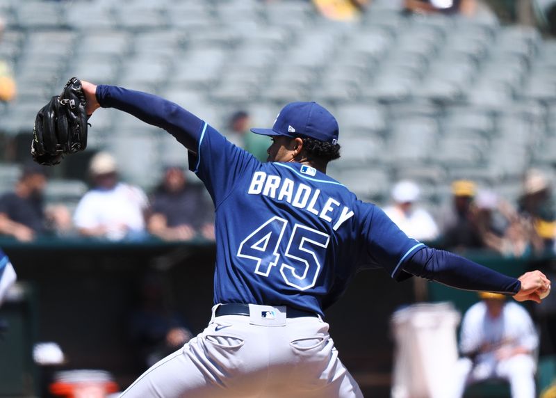 Jun 15, 2023; Oakland, California, USA; Tampa Bay Rays starting pitcher Taj Bradley (45) pitches the ball against the Oakland Athletics during the first inning at Oakland-Alameda County Coliseum. Mandatory Credit: Kelley L Cox-USA TODAY Sports