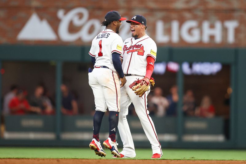 Jun 27, 2023; Atlanta, Georgia, USA; Atlanta Braves second baseman Ozzie Albies (1) and shortstop Orlando Arcia (11) react after an out against the Minnesota Twins in the fifth inning at Truist Park. Mandatory Credit: Brett Davis-USA TODAY Sports