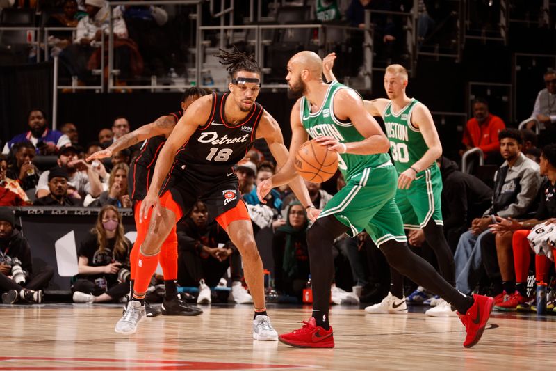 DETROIT, MI - MARCH 22: Tosan Evbuomwan #18 of the Detroit Pistons plays defense against Derrick White #9 of the Boston Celtics on March 22, 2024 at Little Caesars Arena in Detroit, Michigan. NOTE TO USER: User expressly acknowledges and agrees that, by downloading and/or using this photograph, User is consenting to the terms and conditions of the Getty Images License Agreement. Mandatory Copyright Notice: Copyright 2024 NBAE (Photo by Brian Sevald/NBAE via Getty Images)