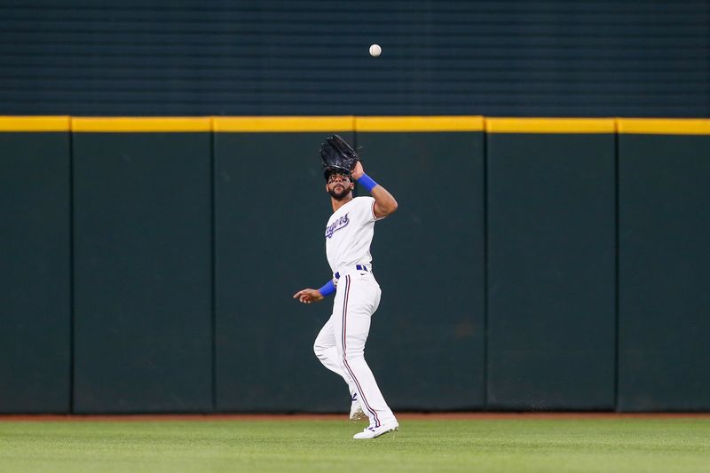 Aug 2, 2023; Arlington, Texas, USA; Texas Rangers center fielder Leody Taveras (3) makes a catch during the eighth inning against the Chicago White Sox at Globe Life Field. Mandatory Credit: Andrew Dieb-USA TODAY Sports