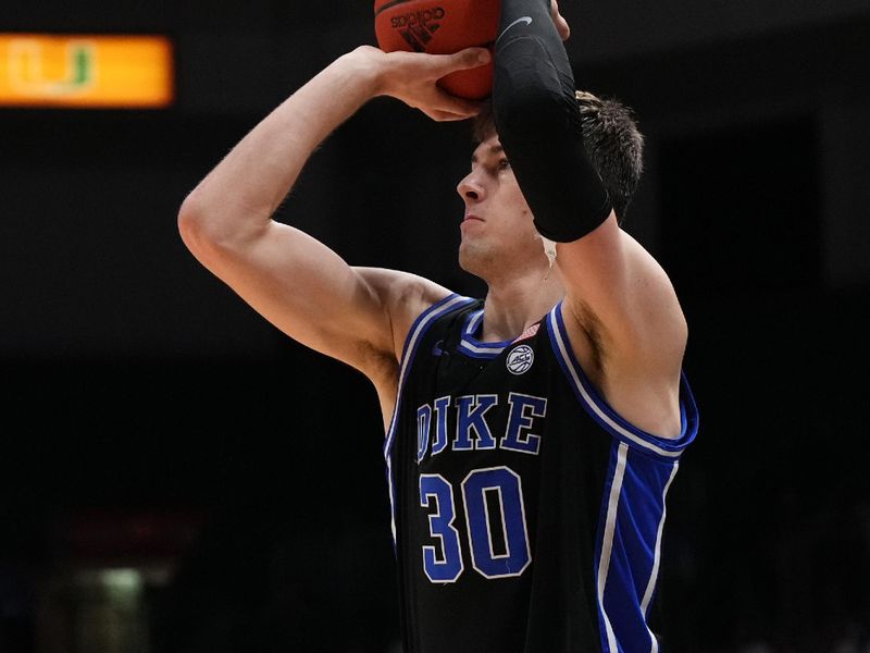 Feb 6, 2023; Coral Gables, Florida, USA; Duke Blue Devils center Kyle Filipowski (30) attempts a three point shot against the Miami Hurricanes during the first half at Watsco Center. Mandatory Credit: Jasen Vinlove-USA TODAY Sports