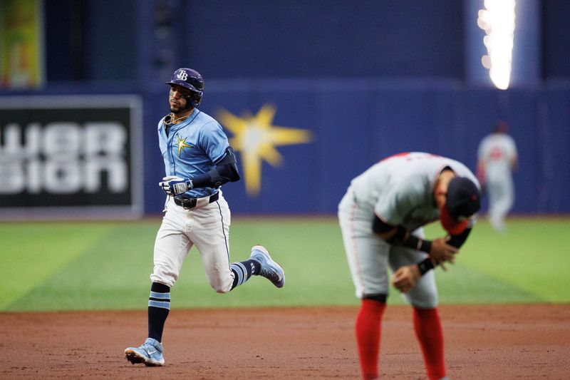 Jun 30, 2024; St. Petersburg, Florida, USA;  Tampa Bay Rays shortstop Jose Caballero (7) runs the bases after hitting a two-run home run against the Washington Nationals in the second inning at Tropicana Field. Mandatory Credit: Nathan Ray Seebeck-USA TODAY Sports