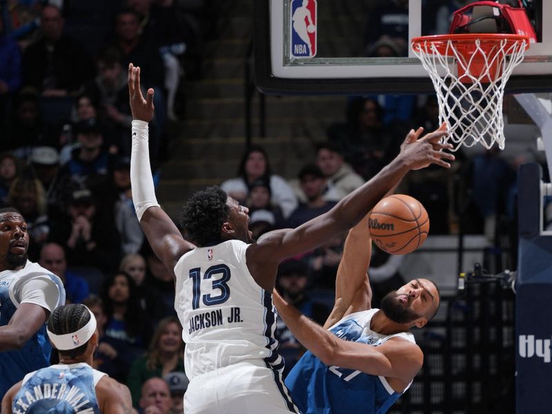 MINNEAPOLIS, MN -  FEBRUARY 28:  Rudy Gobert #27 of the Minnesota Timberwolves plays defense against Jaren Jackson Jr. #13 of the Memphis Grizzlies on February 28, 2024 at Target Center in Minneapolis, Minnesota. NOTE TO USER: User expressly acknowledges and agrees that, by downloading and or using this Photograph, user is consenting to the terms and conditions of the Getty Images License Agreement. Mandatory Copyright Notice: Copyright 2024 NBAE (Photo by Jordan Johnson/NBAE via Getty Images)