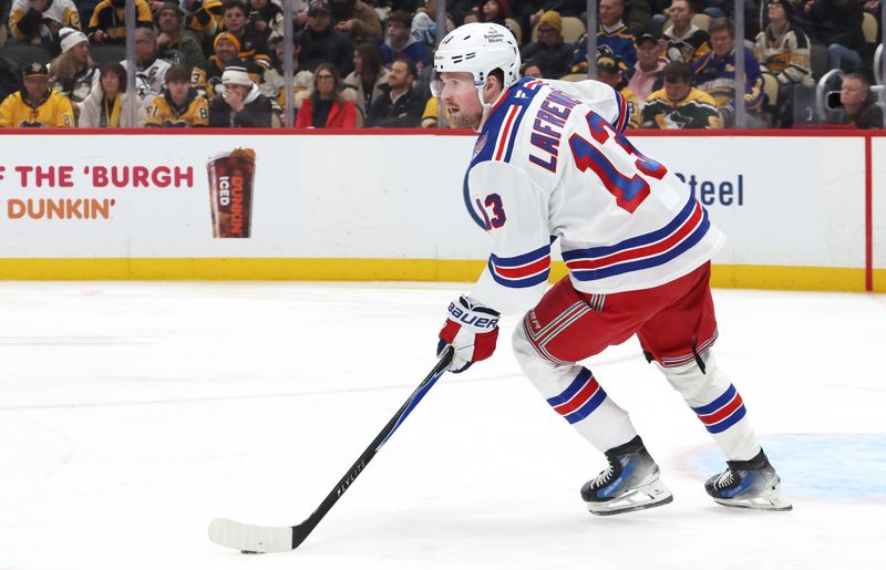 Jan 31, 2026; Pittsburgh, Pennsylvania, USA;  New York Rangers left wing Alexis Lafrenière (13)moves the puck against the Pittsburgh Penguins during the third period at PPG Paints Arena. Mandatory Credit: Charles LeClaire-Imagn Images