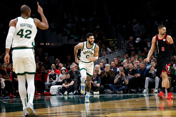 Boston, MA - November 28: Boston Celtics SF Jayson Tatum heads back on defense after scoring in the first quarter. The Celtics beat the Chicago Bulls, 124-97. (Photo by Danielle Parhizkaran/The Boston Globe via Getty Images)