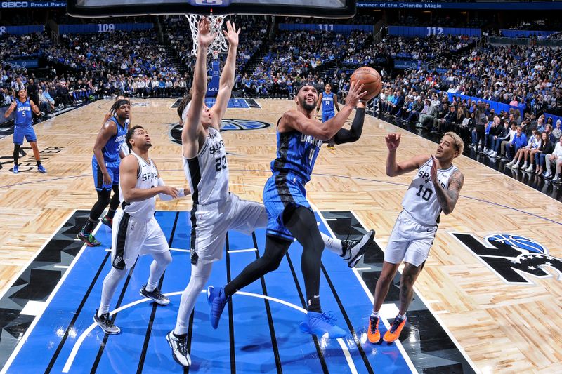 ORLANDO, FL - FEBRUARY 8: Jalen Suggs #4 of the Orlando Magic drives to the basket during the game against the San Antonio Spurs on February 8, 2024 at the Kia Center in Orlando, Florida. NOTE TO USER: User expressly acknowledges and agrees that, by downloading and or using this photograph, User is consenting to the terms and conditions of the Getty Images License Agreement. Mandatory Copyright Notice: Copyright 2024 NBAE (Photo by Fernando Medina/NBAE via Getty Images)