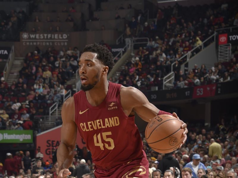 CLEVELAND, OH - FEBRUARY 14: Donovan Mitchell #45 of the Cleveland Cavaliers handles the ball during the game against the Chicago Bulls on February 14, 2024 at Rocket Mortgage FieldHouse in Cleveland, Ohio. NOTE TO USER: User expressly acknowledges and agrees that, by downloading and/or using this Photograph, user is consenting to the terms and conditions of the Getty Images License Agreement. Mandatory Copyright Notice: Copyright 2024 NBAE (Photo by David Liam Kyle/NBAE via Getty Images)