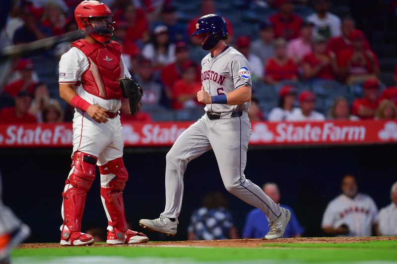 Sep 13, 2024; Anaheim, California, USA; Houston Astros center fielder Jake Meyers (6) scores a run against the Los Angeles Angels during the second inning at Angel Stadium. Mandatory Credit: Gary A. Vasquez-Imagn Images