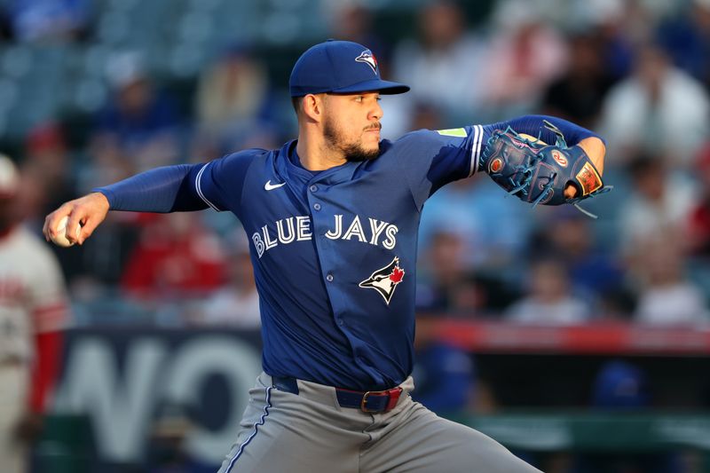 May 7, 2025; Anaheim, California, USA;  Toronto Blue Jays starting pitcher Jose Berrios (17) pitches during the first inning against the Los Angeles Angels at Angel Stadium. Mandatory Credit: Kiyoshi Mio-Imagn Images