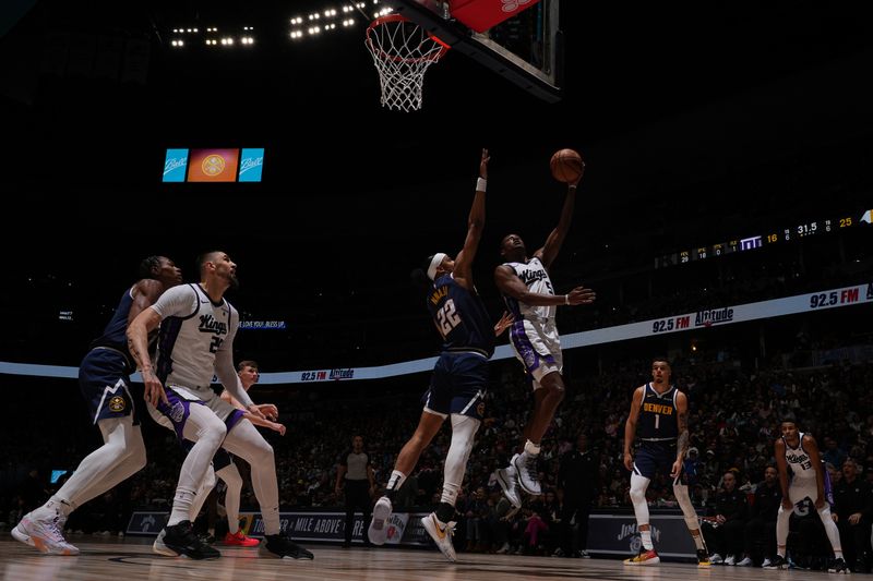 DENVER, CO - FEBRUARY 14: De'Aaron Fox #5 of the Sacramento Kings drives to the basket during the game against the Denver Nuggets on February 14, 2024 at the Ball Arena in Denver, Colorado. NOTE TO USER: User expressly acknowledges and agrees that, by downloading and/or using this Photograph, user is consenting to the terms and conditions of the Getty Images License Agreement. Mandatory Copyright Notice: Copyright 2024 NBAE (Photo by Bart Young/NBAE via Getty Images)