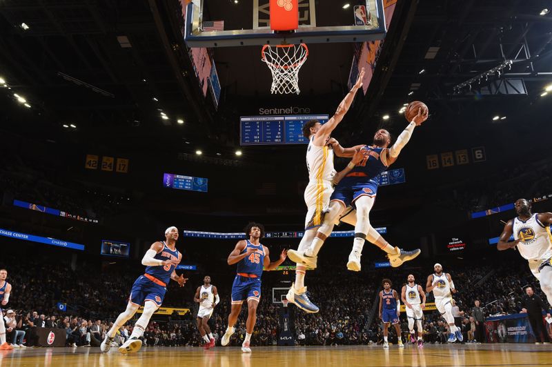 SAN FRANCISCO, CA - MARCH 18: Jalen Brunson #11 of the New York Knicks drives to the basket during the game against the Golden State Warriors on MARCH 18, 2024 at Chase Center in San Francisco, California. NOTE TO USER: User expressly acknowledges and agrees that, by downloading and or using this photograph, user is consenting to the terms and conditions of Getty Images License Agreement. Mandatory Copyright Notice: Copyright 2024 NBAE (Photo by Noah Graham/NBAE via Getty Images)