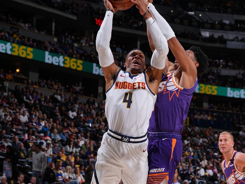 DENVER, CO - OCTOBER 13: Russell Westbrook #4 of the Denver Nuggets drives to the basket during the game against the Phoenix Suns on October 13, 2024 at Ball Arena in Denver, Colorado. NOTE TO USER: User expressly acknowledges and agrees that, by downloading and/or using this Photograph, user is consenting to the terms and conditions of the Getty Images License Agreement. Mandatory Copyright Notice: Copyright 2024 NBAE (Photo by Garrett Ellwood/NBAE via Getty Images)