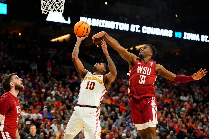 Mar 23, 2024; Omaha, NE, USA; Iowa State Cyclones guard Keshon Gilbert (10) shoots the ball against Washington State Cougars guard Kymany Houinsou (31) during the second half of the second round of the 2024 NCAA Tournament at CHI Health Center Omaha. Mandatory Credit: Dylan Widger-USA TODAY Sports