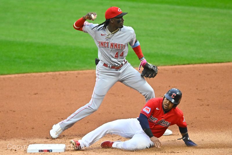 Sep 27, 2023; Cleveland, Ohio, USA; Cincinnati Reds shortstop Elly De La Cruz (44) turns a double play beside Cleveland Guardians designated hitter Jose Ramirez (11) in the first inning at Progressive Field. Mandatory Credit: David Richard-USA TODAY Sports