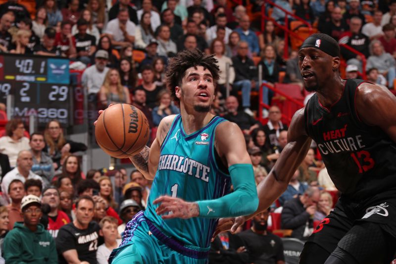 MIAMI, FL - JANUARY 14: LaMelo Ball #1 of the Charlotte Hornets drives to the basket during the game against the Miami Heat on January 14, 2024 at Kaseya Center in Miami, Florida. NOTE TO USER: User expressly acknowledges and agrees that, by downloading and or using this Photograph, user is consenting to the terms and conditions of the Getty Images License Agreement. Mandatory Copyright Notice: Copyright 2024 NBAE (Photo by Issac Baldizon/NBAE via Getty Images)