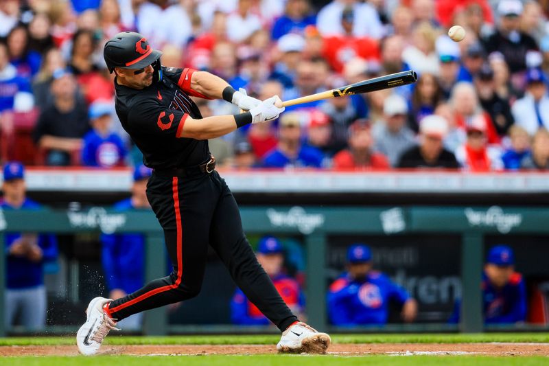 May 23, 2025; Cincinnati, Ohio, USA; Cincinnati Reds first baseman Spencer Steer (7) hits a RBI double in the first inning against the Chicago Cubs at Great American Ball Park. Mandatory Credit: Katie Stratman-Imagn Images