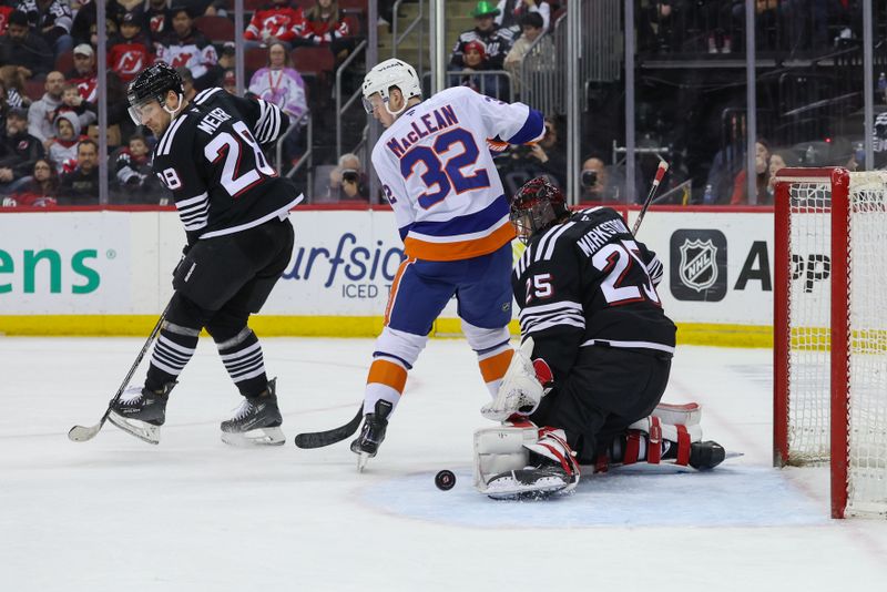 Apr 13, 2025; Newark, New Jersey, USA; New Jersey Devils goaltender Jacob Markstrom (25) makes a save against the New York Islanders during the first period at Prudential Center. Mandatory Credit: Ed Mulholland-Imagn Images