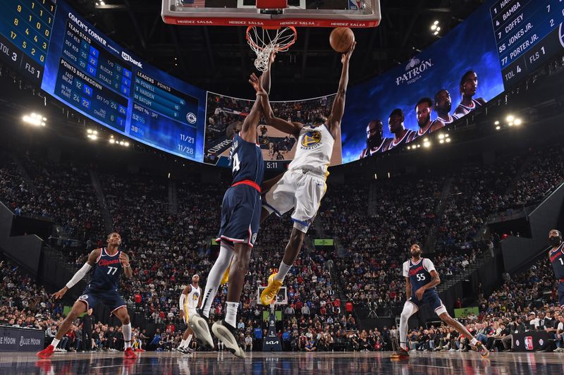 INGLEWOOD, CA - NOVEMBER 18: Andrew Wiggins #22 of the Golden State Warriors drives to the basket during the game against the LA Clippers on November 18, 2024 at Intuit Dome in Los Angeles, California. NOTE TO USER: User expressly acknowledges and agrees that, by downloading and/or using this Photograph, user is consenting to the terms and conditions of the Getty Images License Agreement. Mandatory Copyright Notice: Copyright 2024 NBAE (Photo by Juan Ocampo/NBAE via Getty Images)